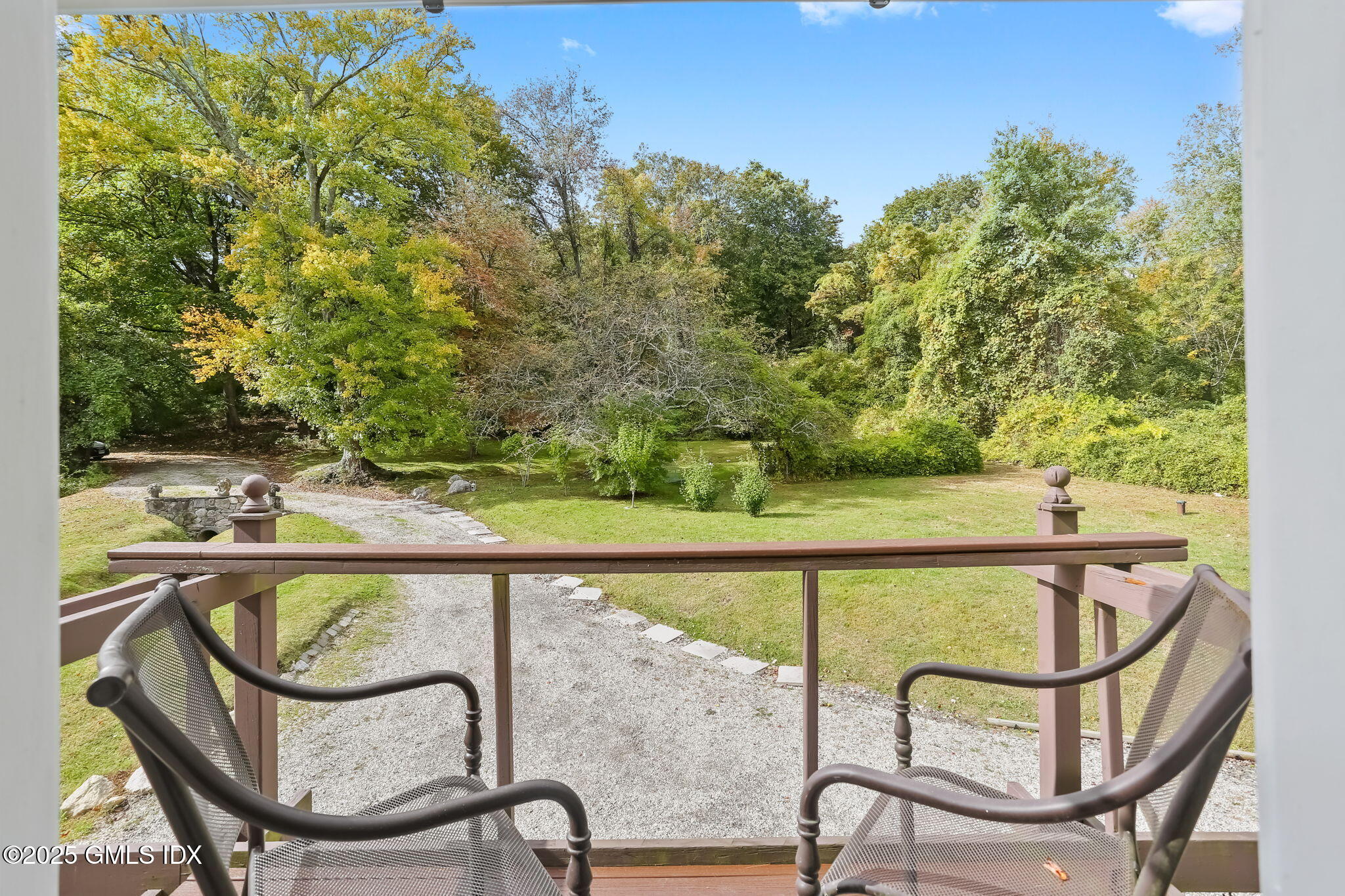 527 Stanwich Road, Unit COTTAGE Greenwich, CT 06831 - Photo 11 of 18 a view of a swimming pool with a lounge chair