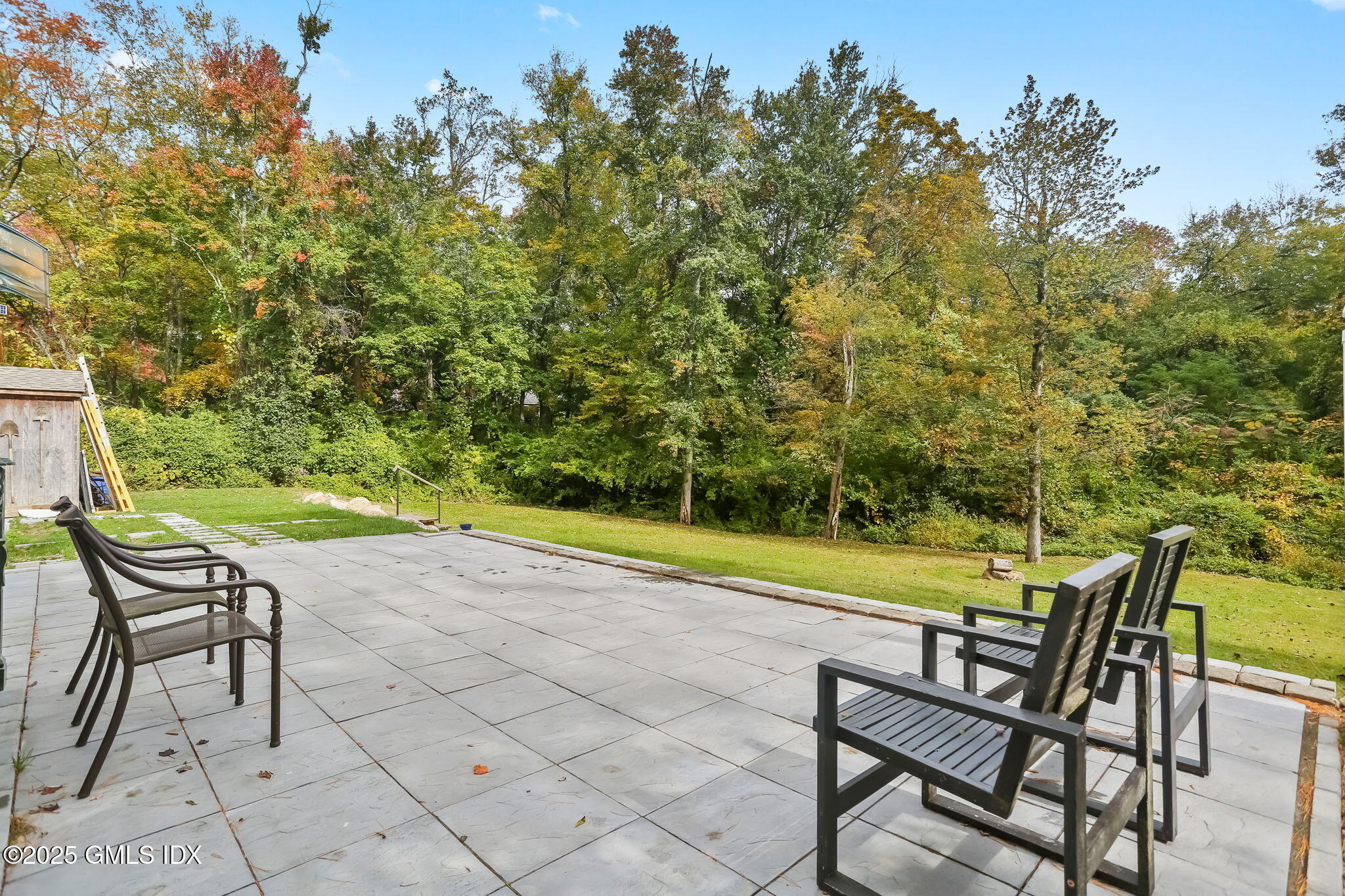 527 Stanwich Road, Unit COTTAGE Greenwich, CT 06831 - Photo 12 of 18 a view of a swimming pool with lounge chair
