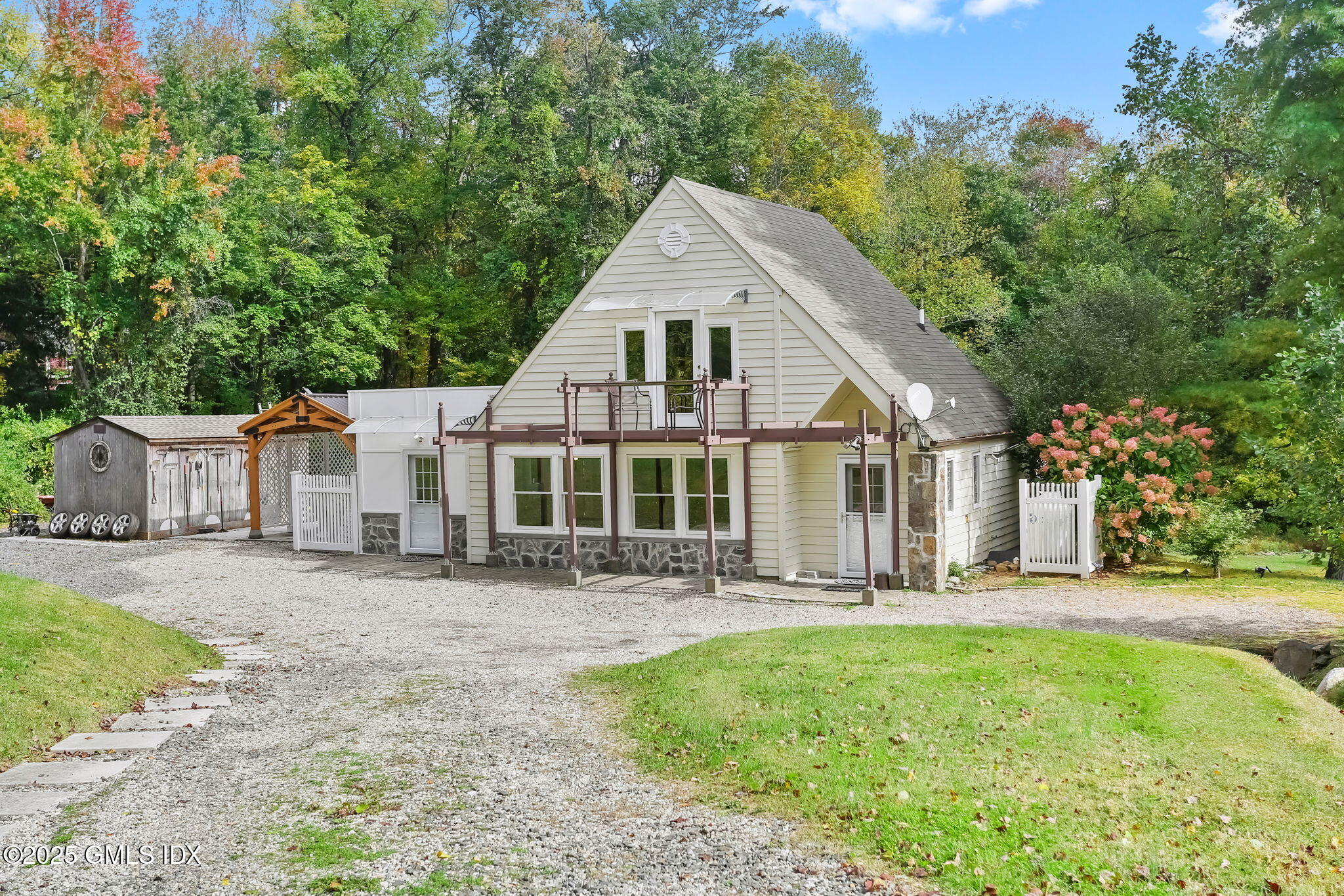 527 Stanwich Road, Unit COTTAGE Greenwich, CT 06831 - Photo 16 of 18 front view of a house with a yard