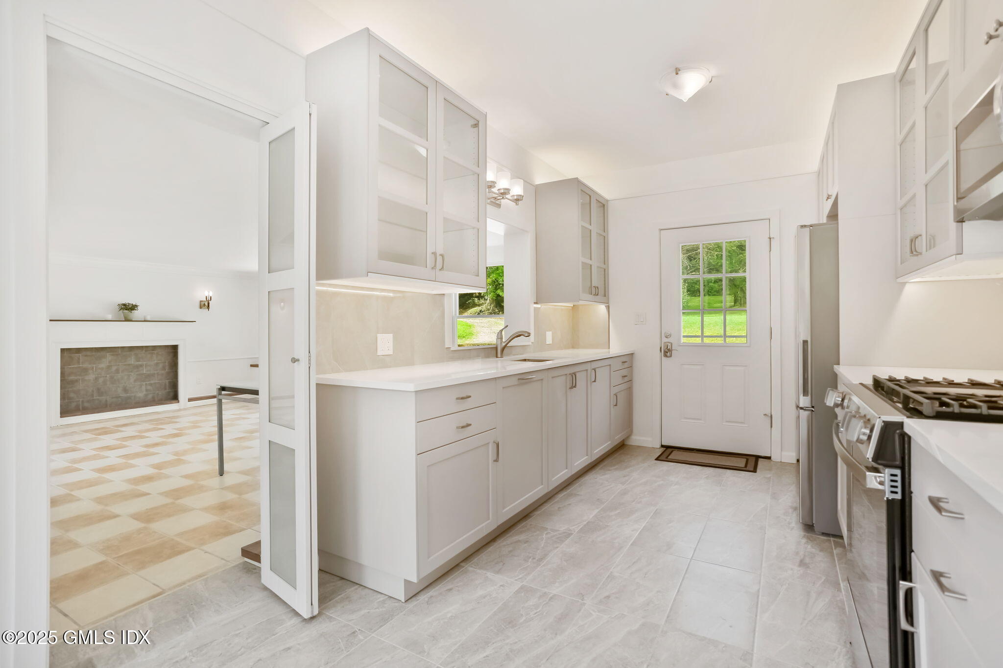 527 Stanwich Road, Unit COTTAGE Greenwich, CT 06831 - Photo 3 of 18 a view of a kitchen with a sink