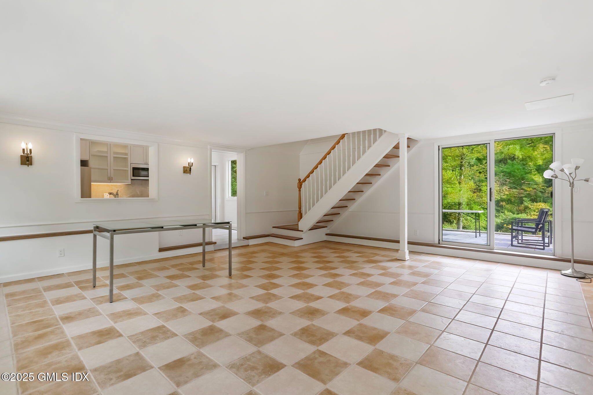 527 Stanwich Road, Unit COTTAGE Greenwich, CT 06831 - Photo 6 of 18 a view of an empty room with windows