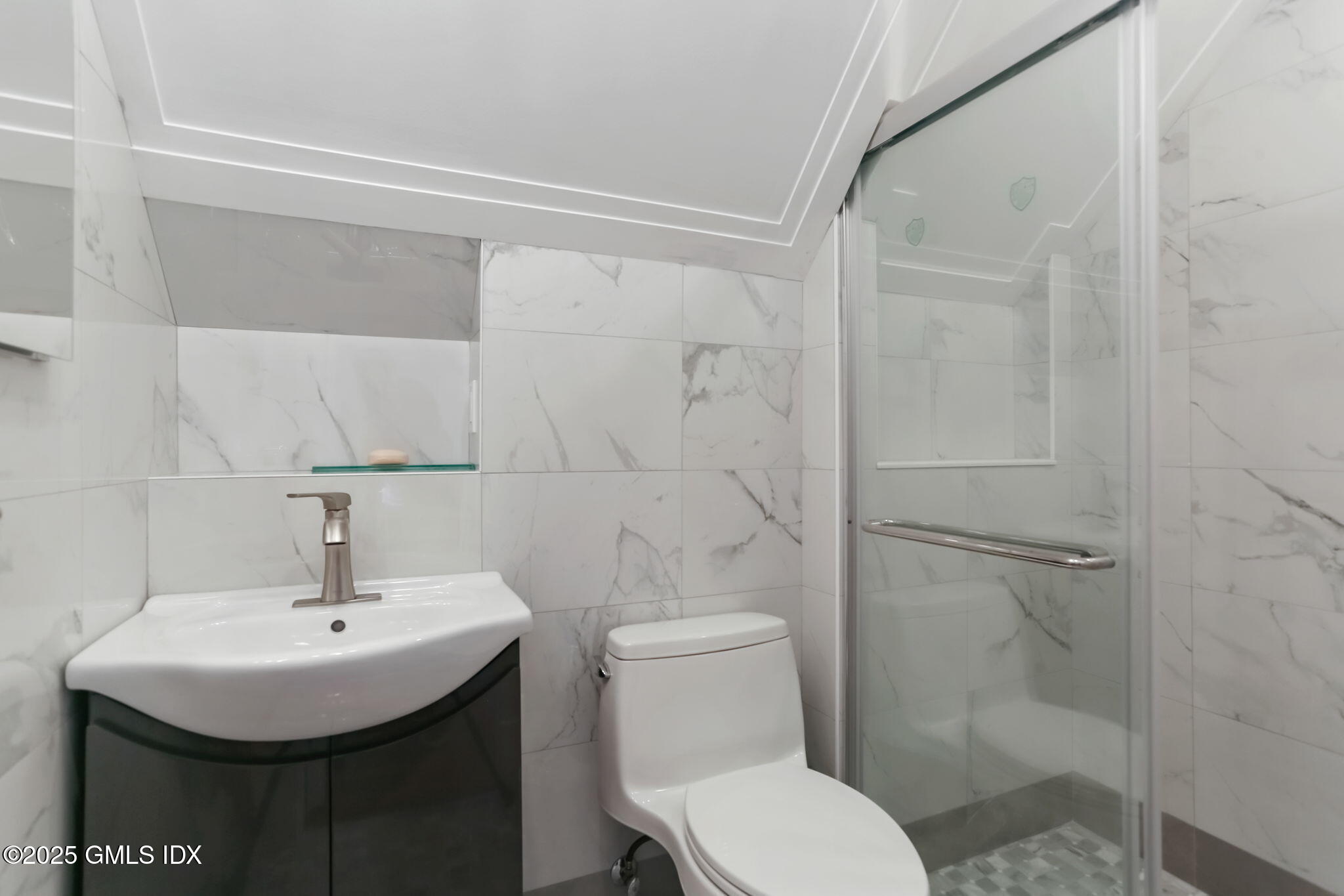 527 Stanwich Road, Unit COTTAGE Greenwich, CT 06831 - Photo 10 of 18 a bathroom with a sink toilet and shower