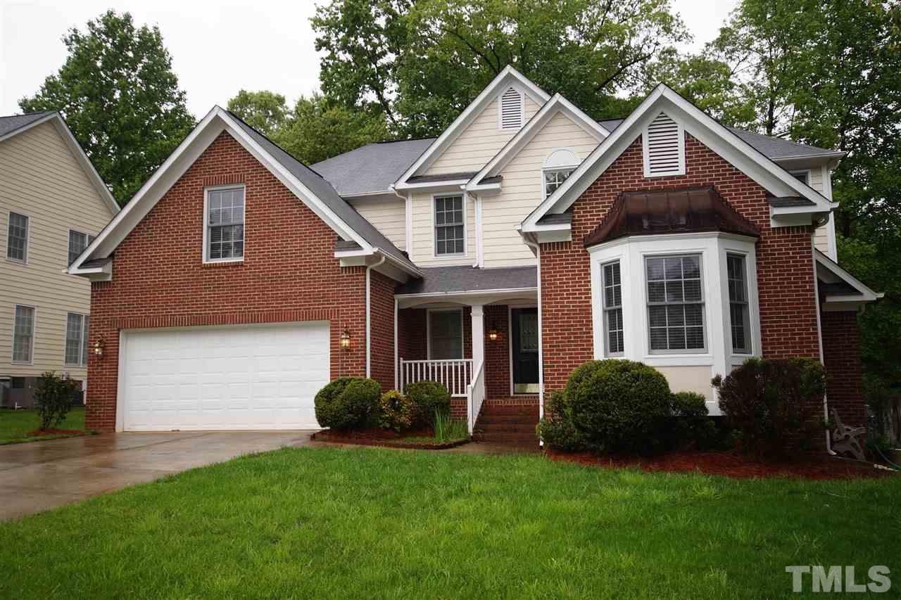 7908 Broad Street Raleigh, NC 27613 - Photo 1 of 24 a front view of a house with a yard and porch