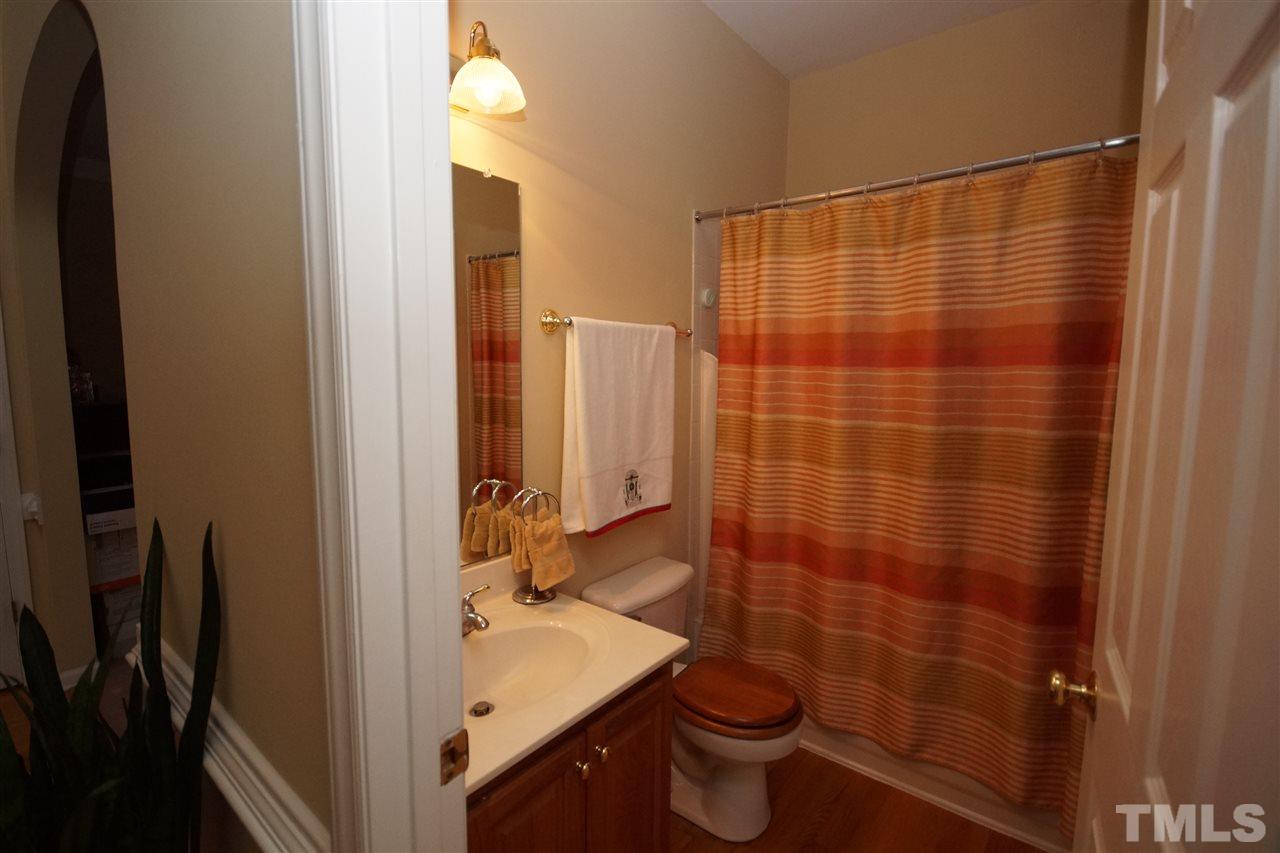 7908 Broad Street Raleigh, NC 27613 - Photo 12 of 24 a bathroom with a sink and a shower
