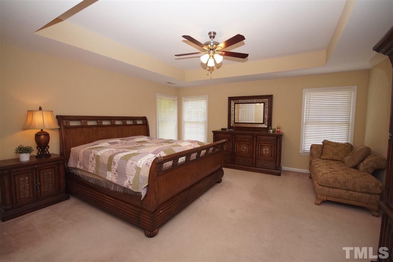 7908 Broad Street Raleigh, NC 27613 - Photo 13 of 24 a bedroom with a bed couch and window