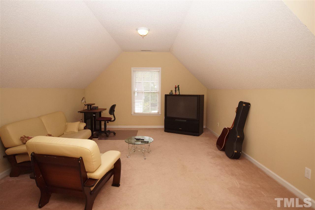 7908 Broad Street Raleigh, NC 27613 - Photo 19 of 24 a bedroom with furniture and a window