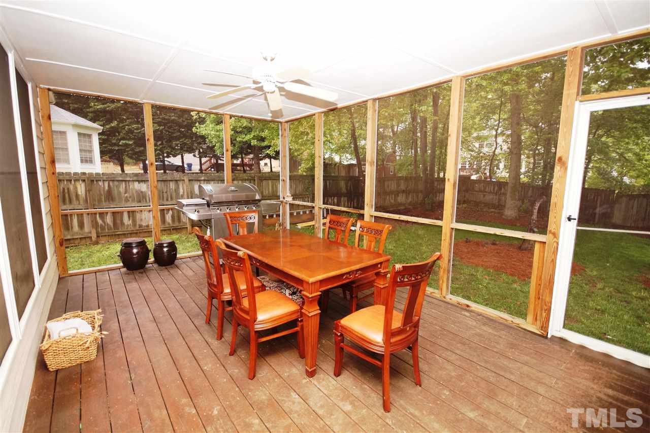 7908 Broad Street Raleigh, NC 27613 - Photo 22 of 24 a view of a balcony with chairs and wooden floor