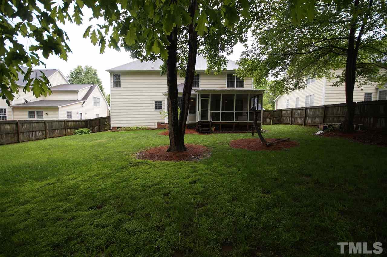 7908 Broad Street Raleigh, NC 27613 - Photo 24 of 24 a view of a house with a backyard and a tree