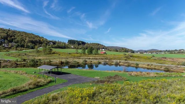 a view of a field with sitting area