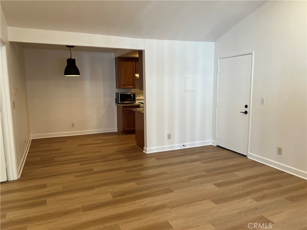25611 Quail Run, Unit 100 Dana Point, CA 92629 - Photo 3 of 13 a view of empty room with wooden floor and fan