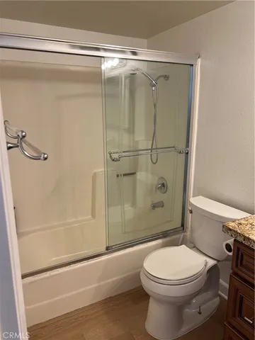 a bathroom with a toilet and shower