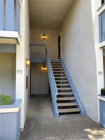 a view of entryway and hall with a chair