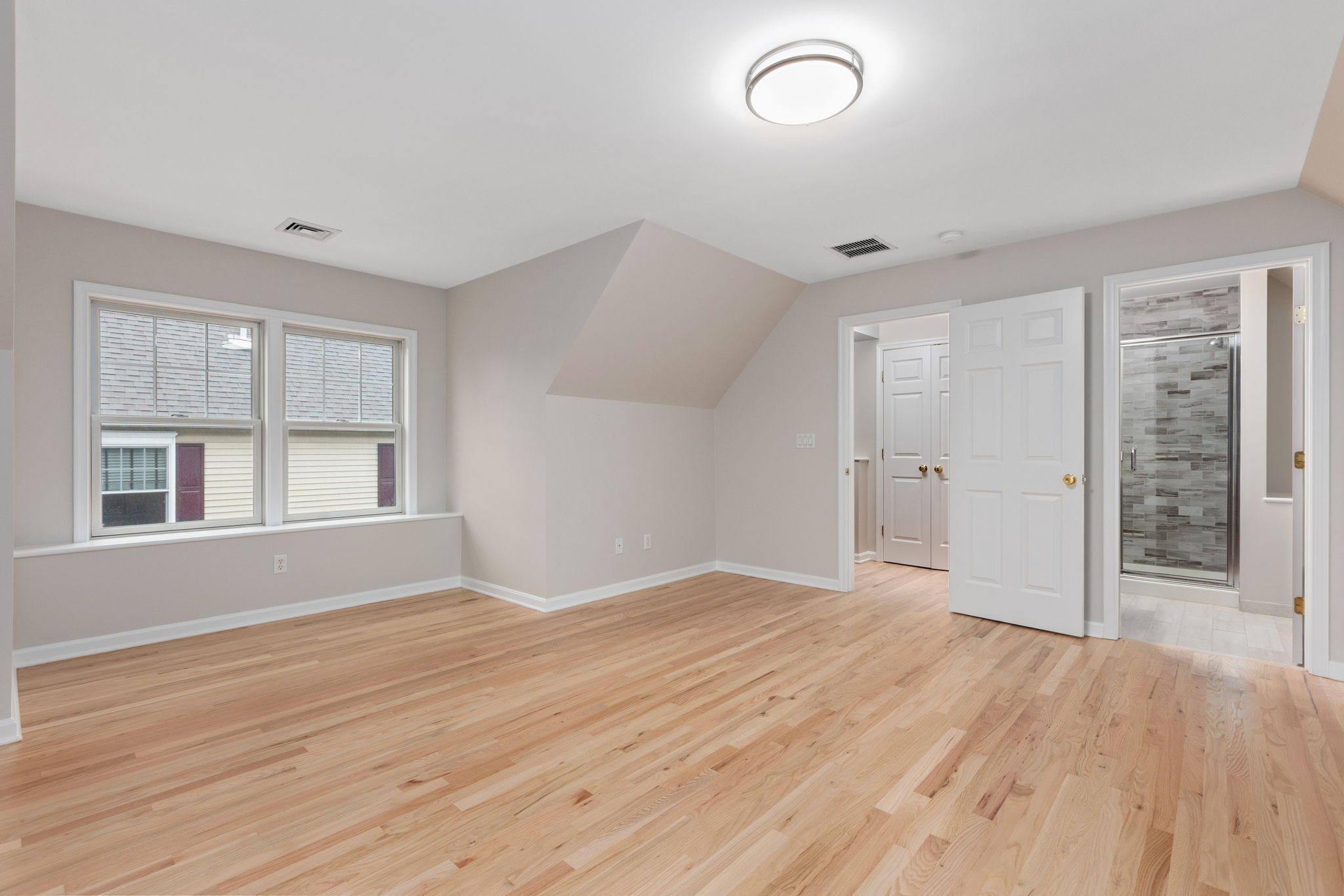 160 Glenbrook Road, Unit 3D Stamford, CT 06902 - Photo 19 of 26 a view of an empty room with a window and wooden floor