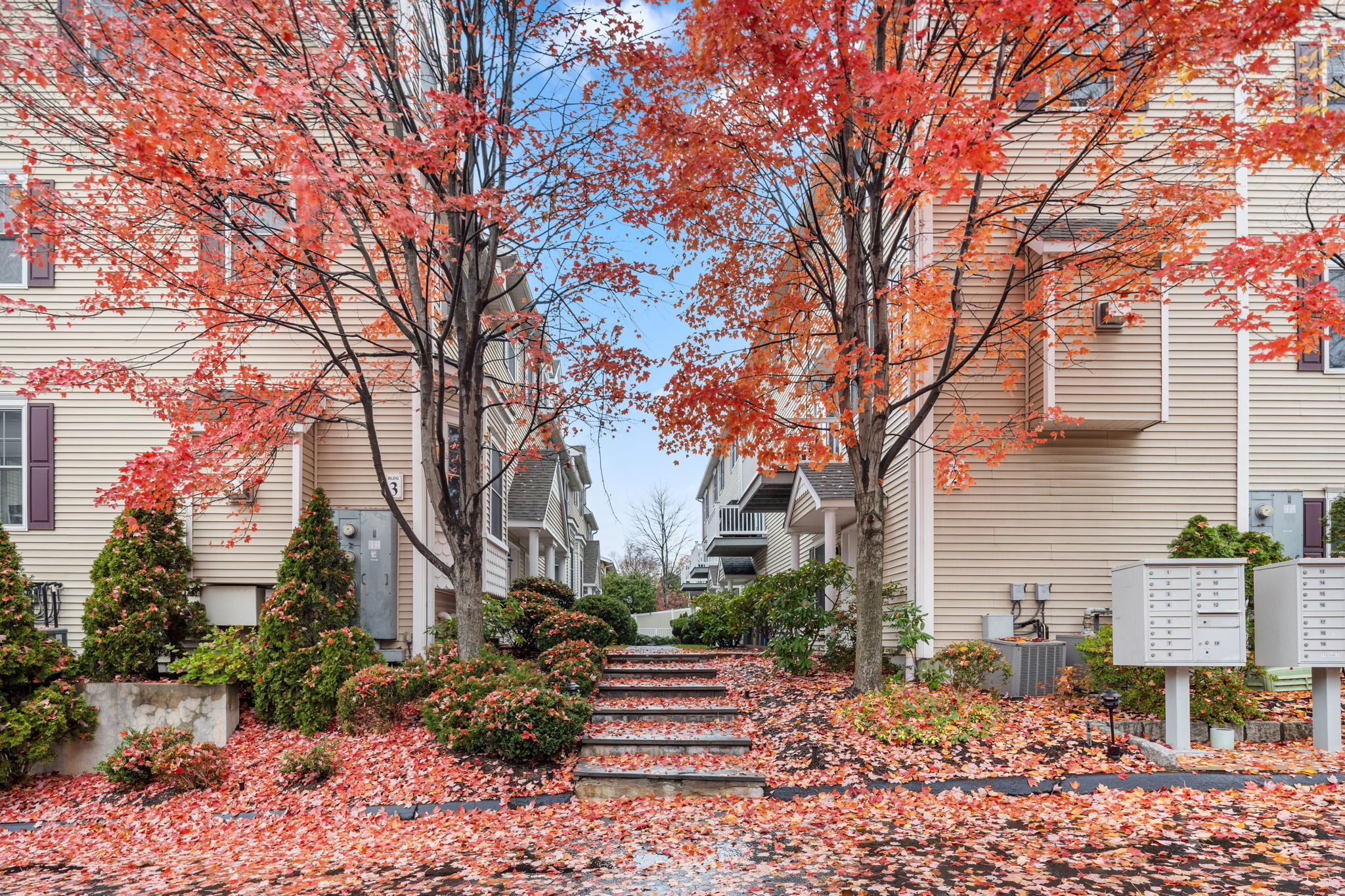 160 Glenbrook Road, Unit 3D Stamford, CT 06902 - Photo 2 of 26 a front view of a house with a garden