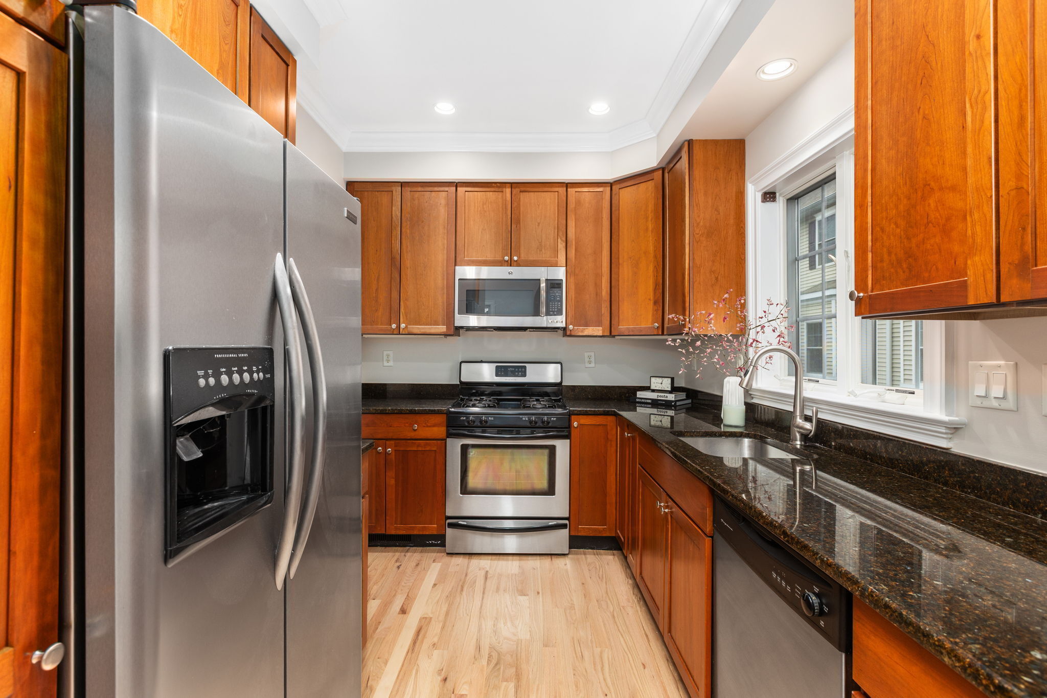 160 Glenbrook Road, Unit 3D Stamford, CT 06902 - Photo 8 of 26 a kitchen with stainless steel appliances granite countertop a stove a sink and a refrigerator
