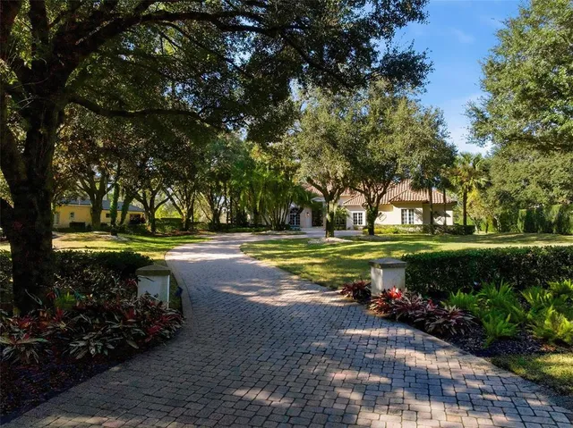 a living room with furniture a window and wooden floor