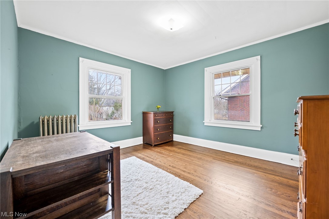 12727 Cedar Road Cleveland Heights, OH 44106 - Photo 23 of 32 Bedroom featuring hardwood floors, crown molding, multiple windows