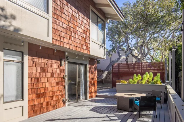 a view of a chairs and table in the patio