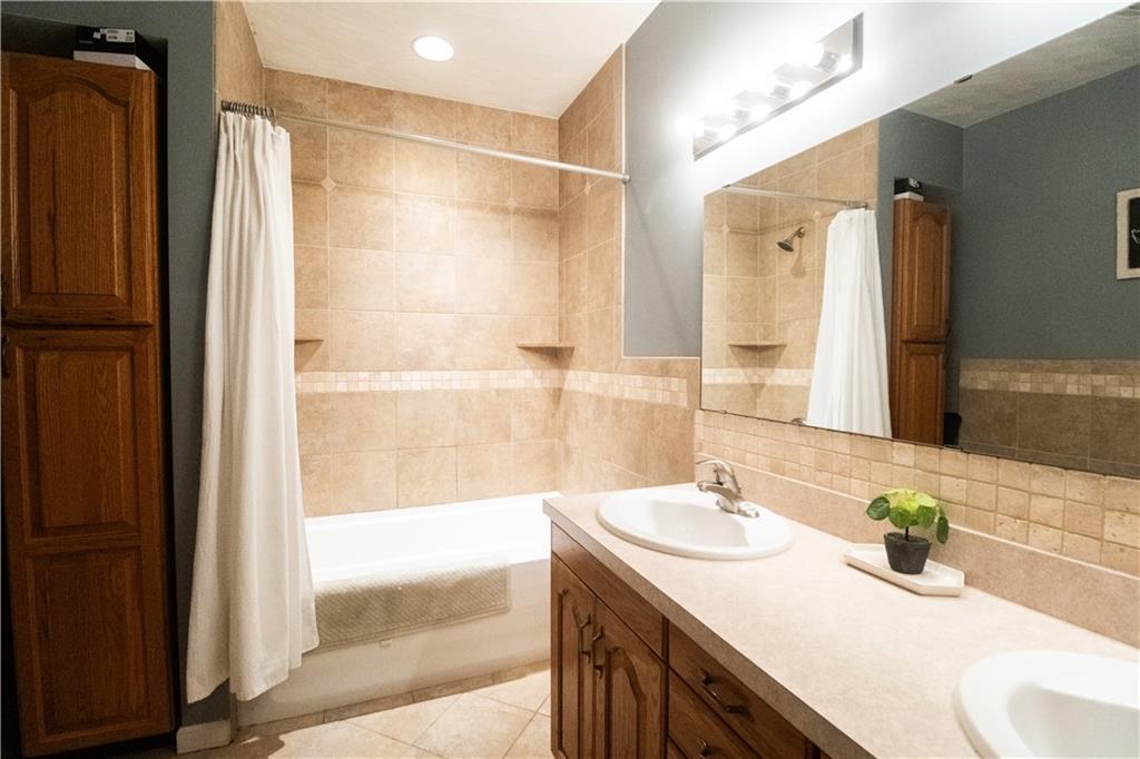 210 Whitestown Road Butler, PA 16001 - Photo 14 of 19 a bathroom with a sink and a mirror