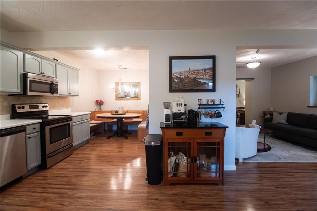 210 Whitestown Road Butler, PA 16001 - Photo 2 of 19 a kitchen with stainless steel appliances granite countertop a stove top oven a sink a counter space and cabinets