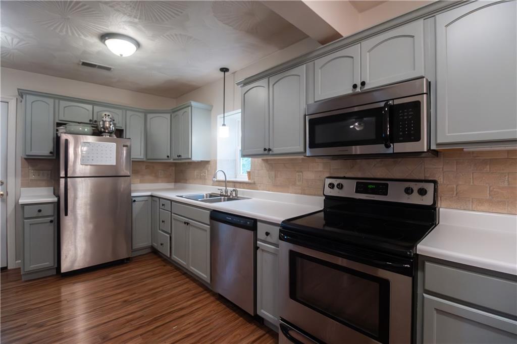 210 Whitestown Road Butler, PA 16001 - Photo 7 of 19 a kitchen with a stove microwave and refrigerator