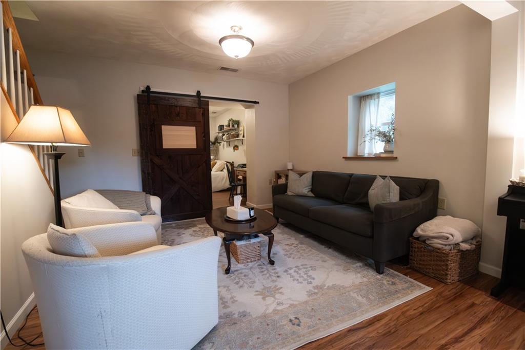 210 Whitestown Road Butler, PA 16001 - Photo 9 of 19 a living room with furniture and a wooden floor