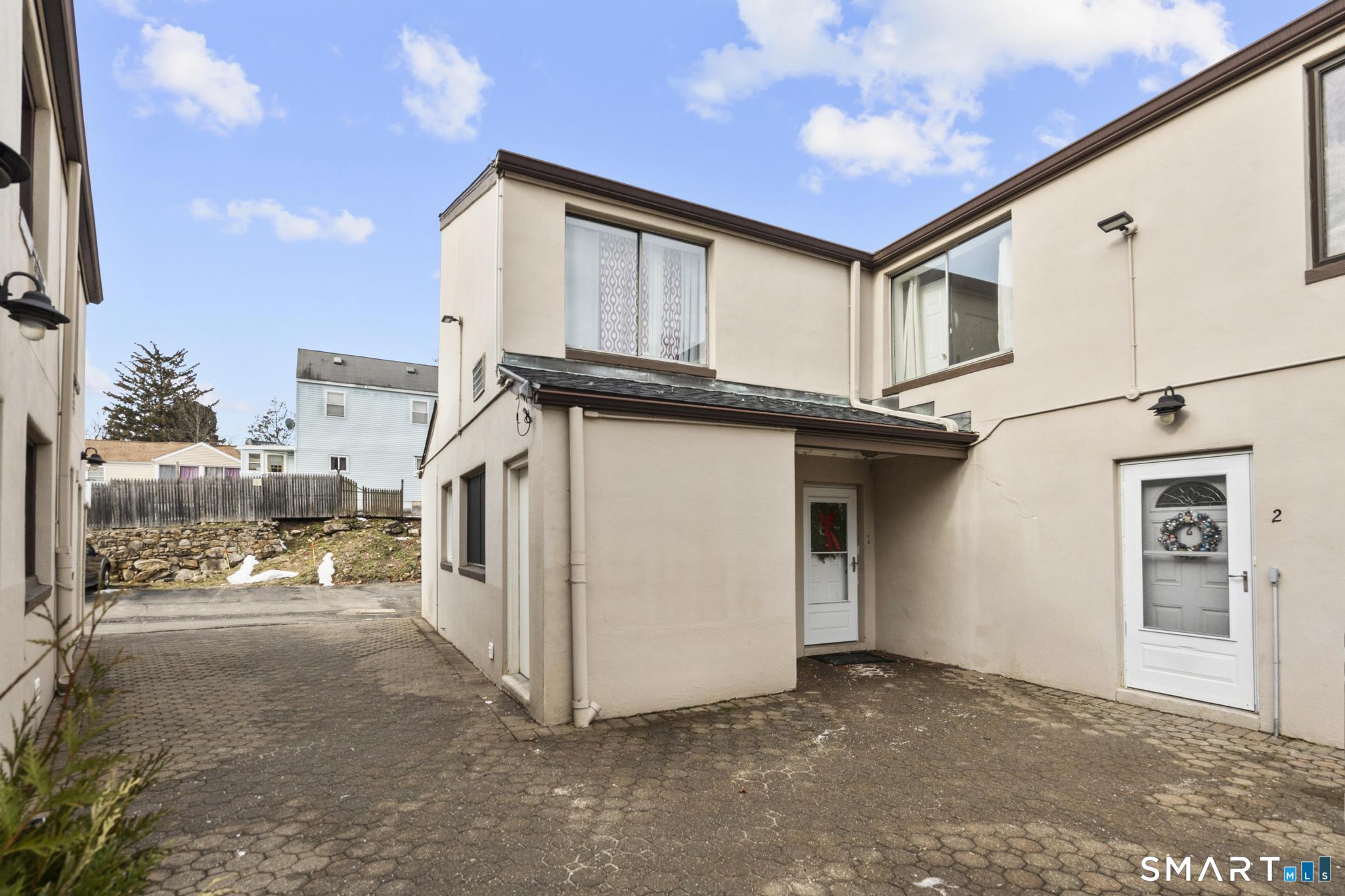 84 Taylor Avenue, Unit 1 Norwalk, CT 06854 - Photo 2 of 40 a view of a house with a flat screen tv