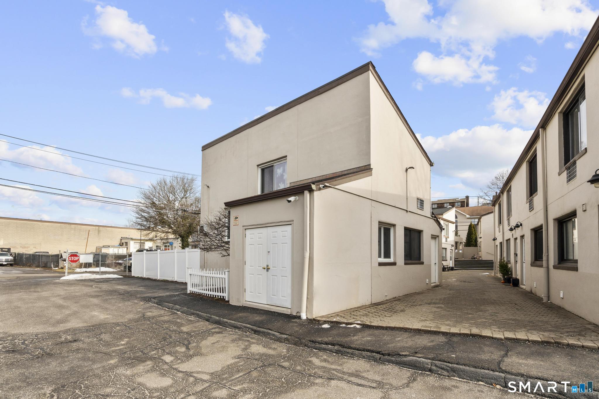84 Taylor Avenue, Unit 1 Norwalk, CT 06854 - Photo 3 of 40 a view of a house with a yard