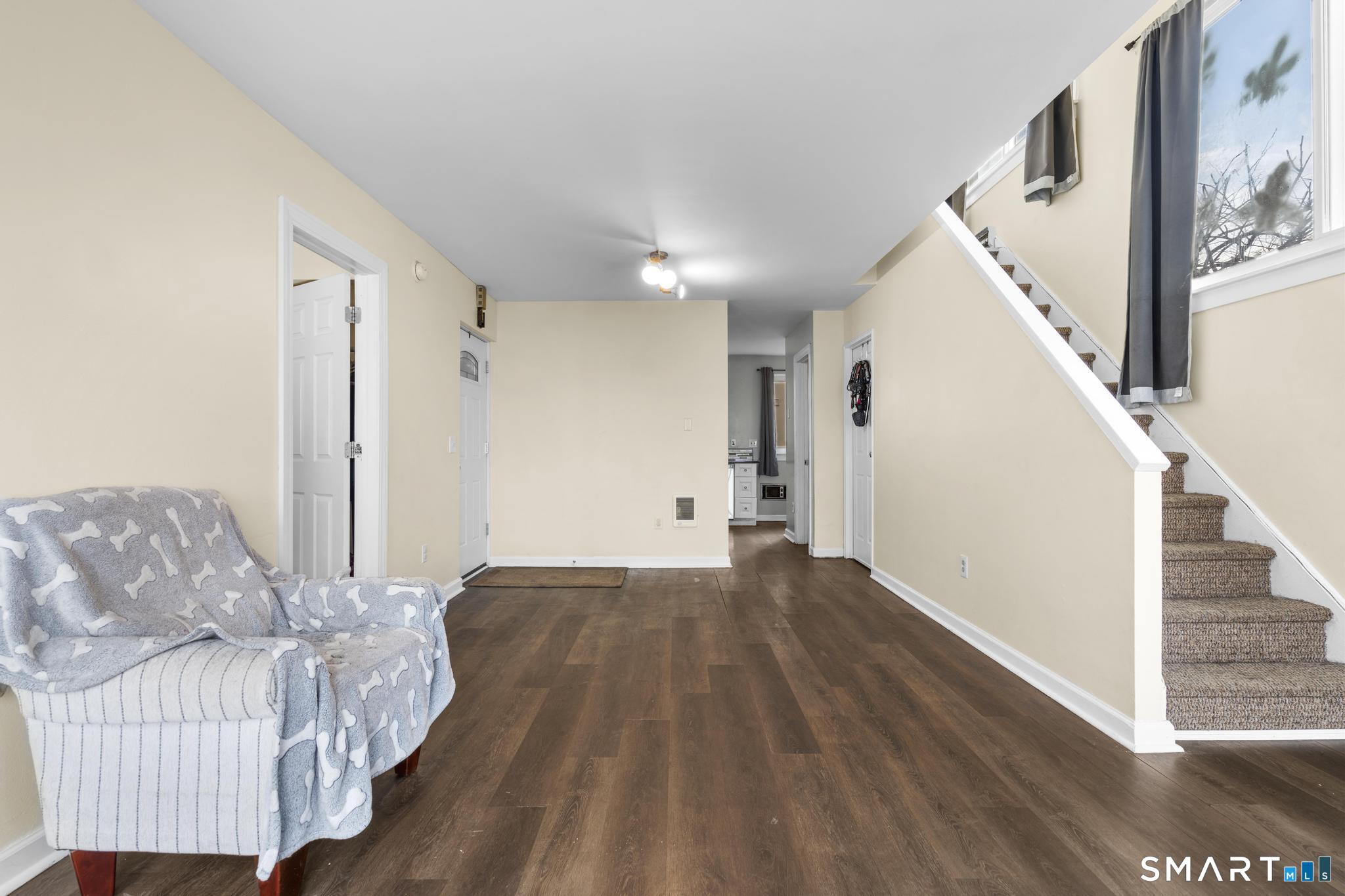 84 Taylor Avenue, Unit 1 Norwalk, CT 06854 - Photo 8 of 40 a view of livingroom with furniture and wooden floor