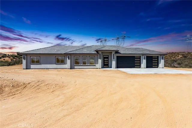 a house with swimming pool in front of it