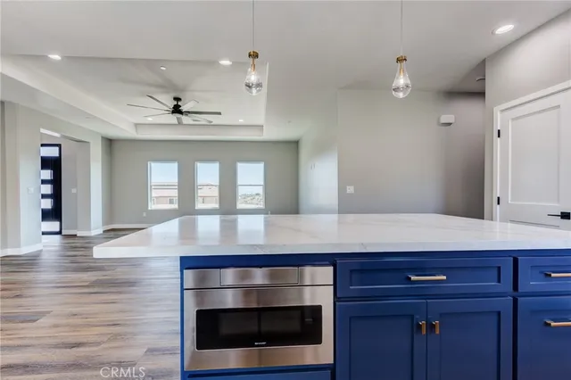 a view of room with a fireplace and wooden floor