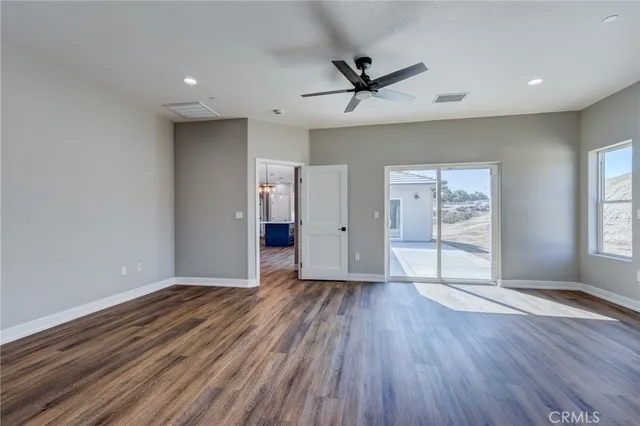 a kitchen with cabinets appliances a sink and a window