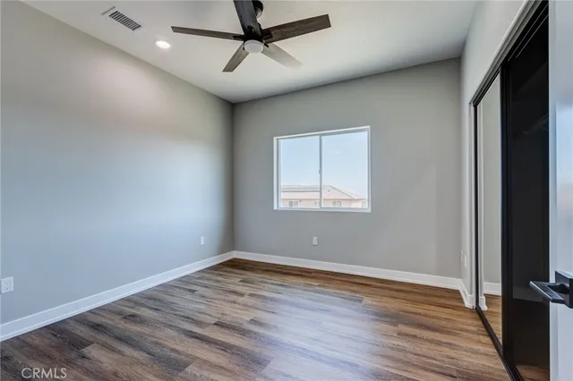 a bathroom with a tub sink toilet and a mirror