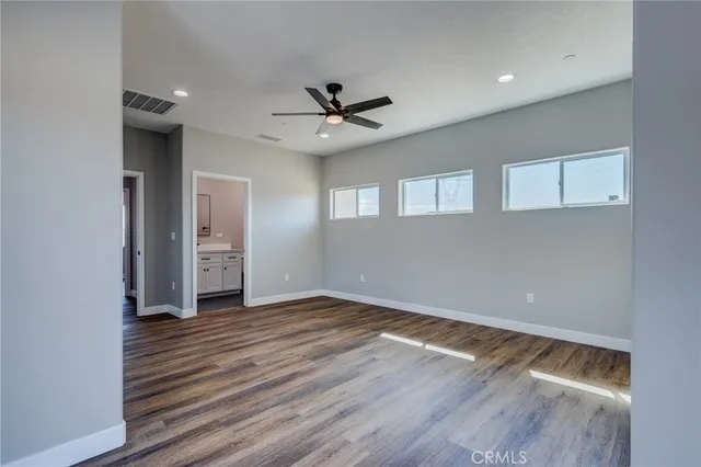 a bathroom with a sink toilet vanity and tub