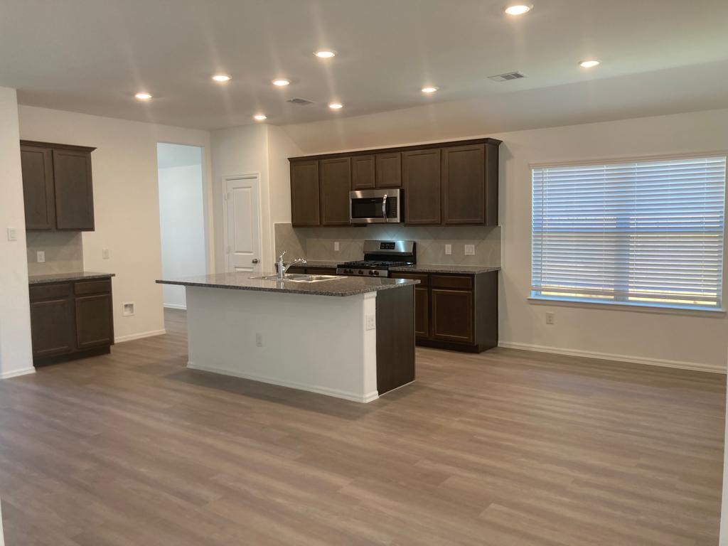 3731 Lion Creek Rosenberg, TX 77469 - Photo 3 of 13 Open concept living area with spacious family room and island kitchen.