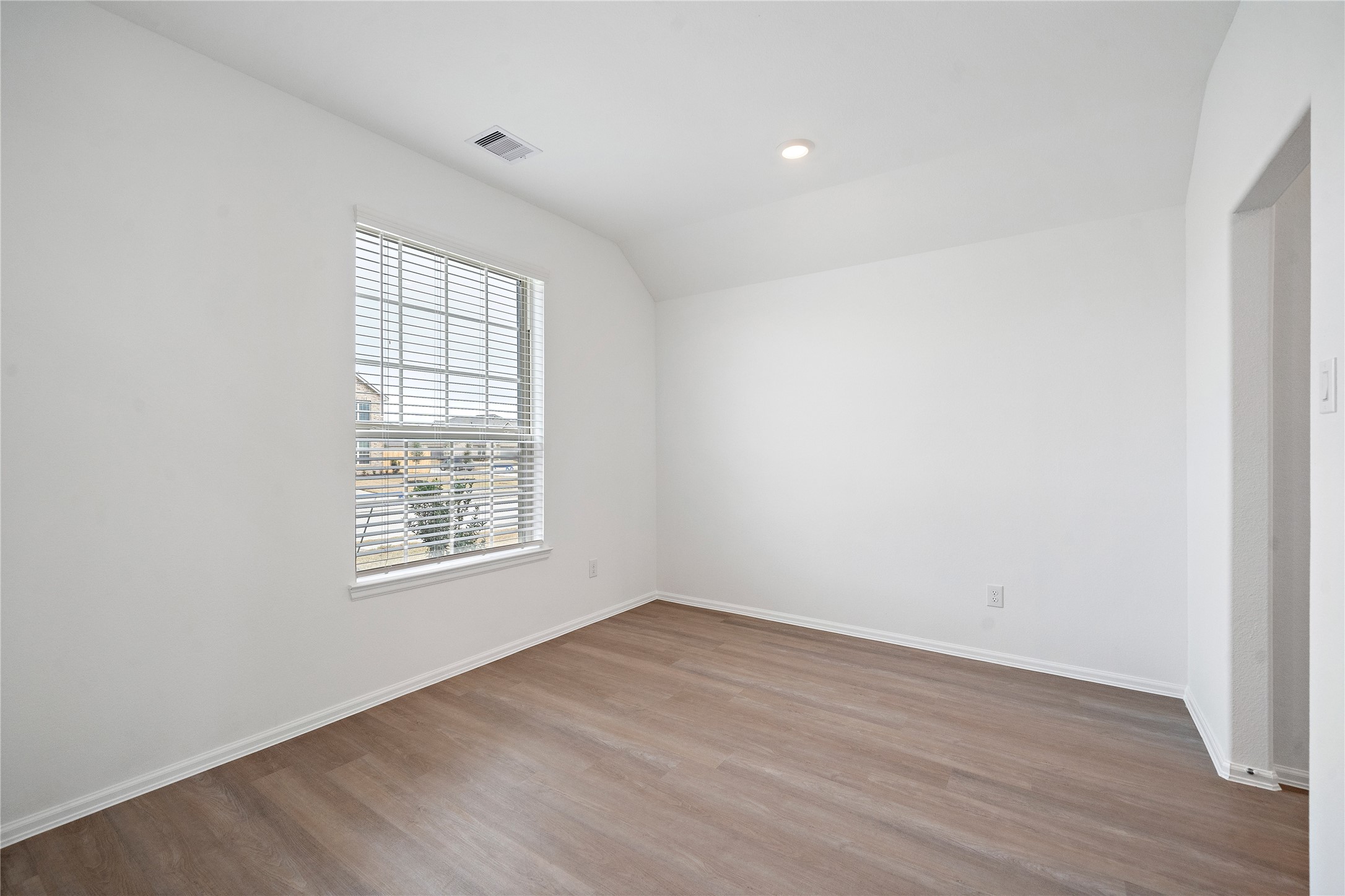 3731 Lion Creek Rosenberg, TX 77469 - Photo 3 of 13 an empty room with wooden floor and windows