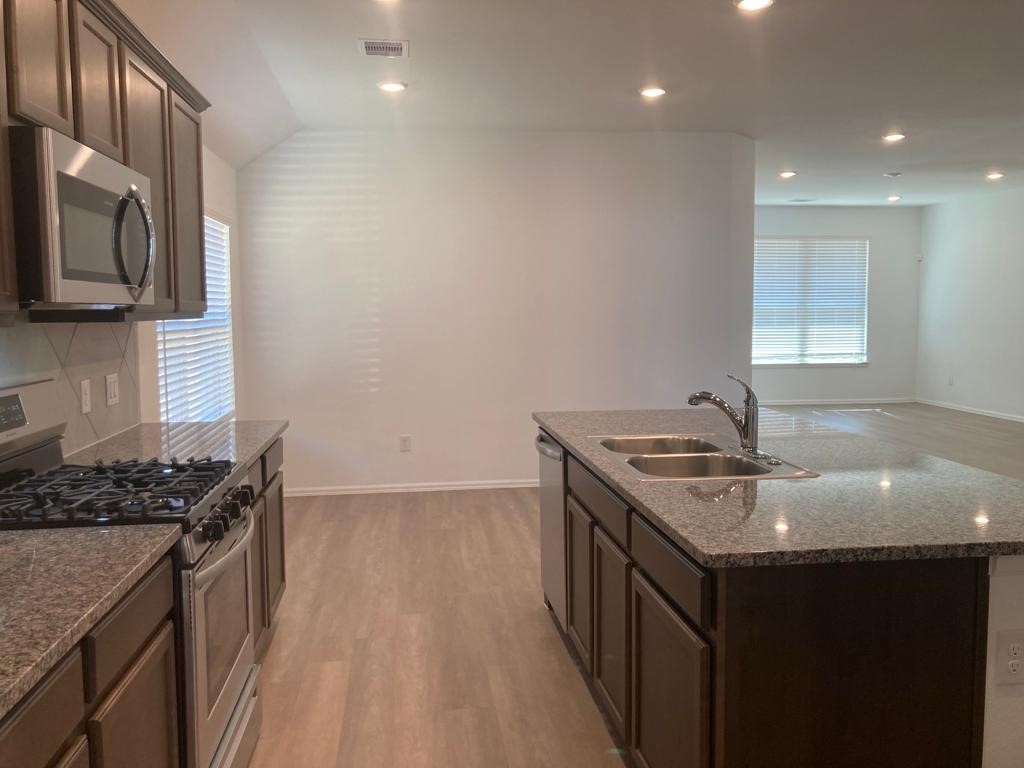 3731 Lion Creek Rosenberg, TX 77469 - Photo 5 of 13 Kitchen view highlighting ample counter space and open layout.