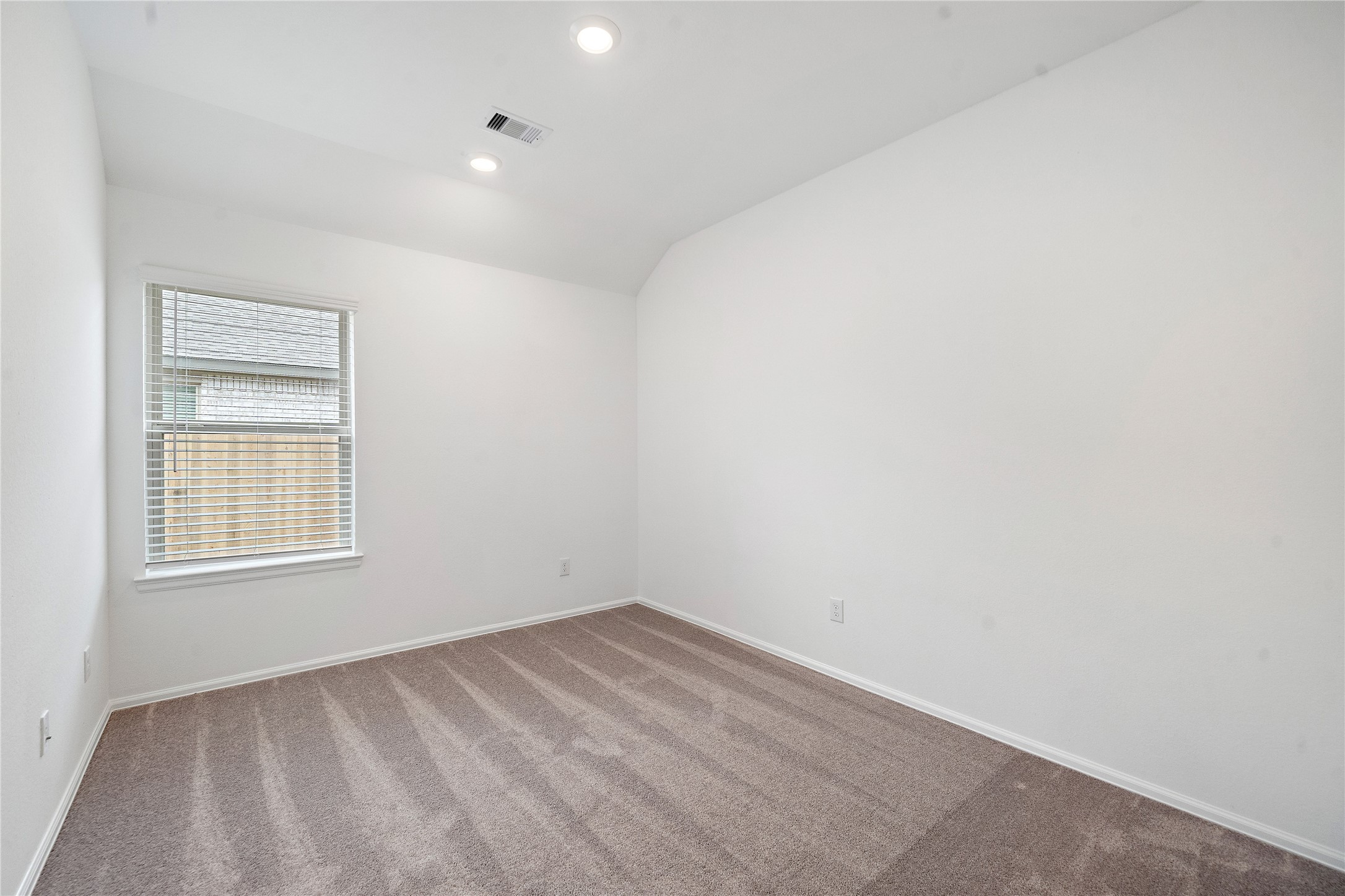 3731 Lion Creek Rosenberg, TX 77469 - Photo 8 of 13 Secondary bedroom with neutral tones and natural light.