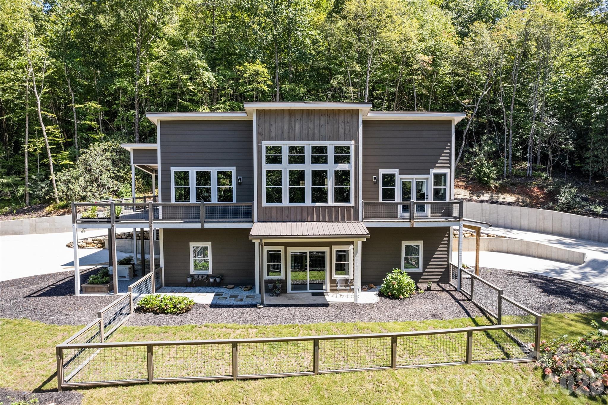 1185 Wallalieu Road Otto, NC 28763 - Photo 3 of 43 a view of house with outdoor seating