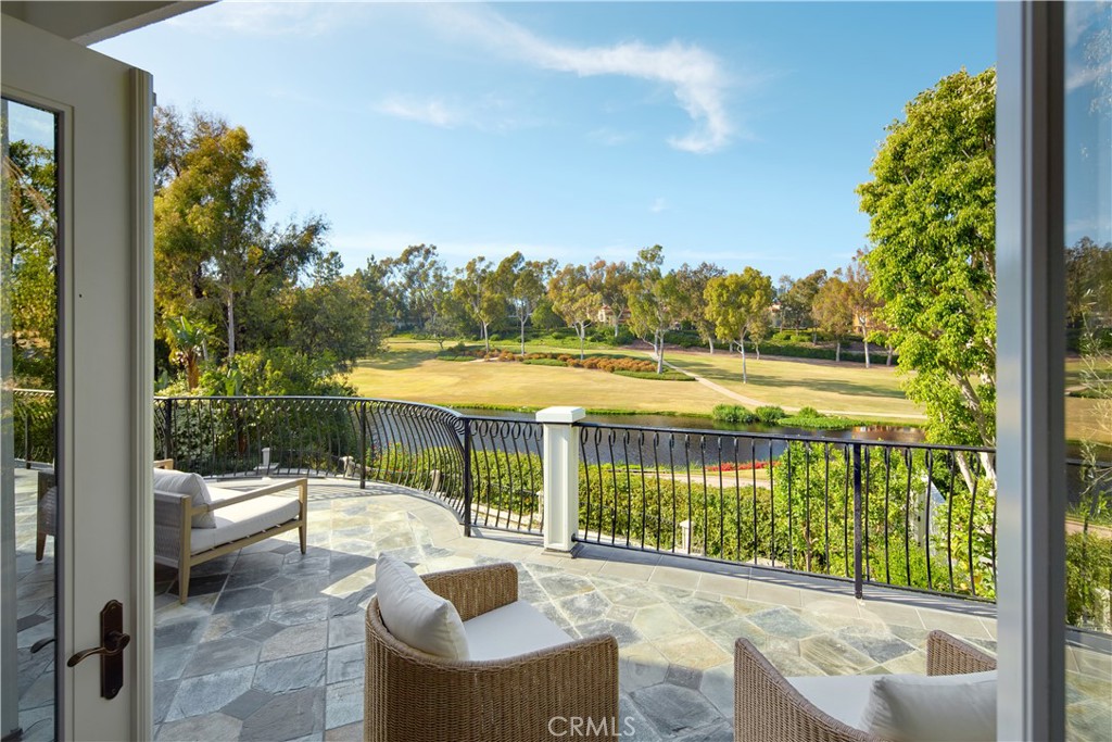 2 Royal St George Road Newport Beach, CA 92660 - Photo 15 of 48 a view of a balcony with lake view and a floor to ceiling window