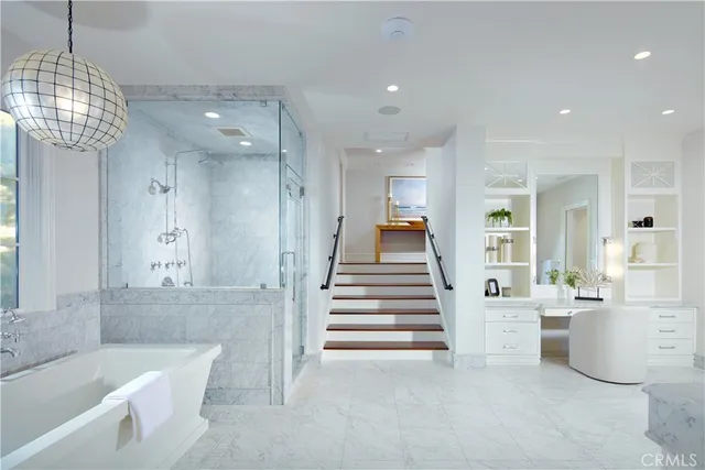 a bathroom with a tub shower and sink