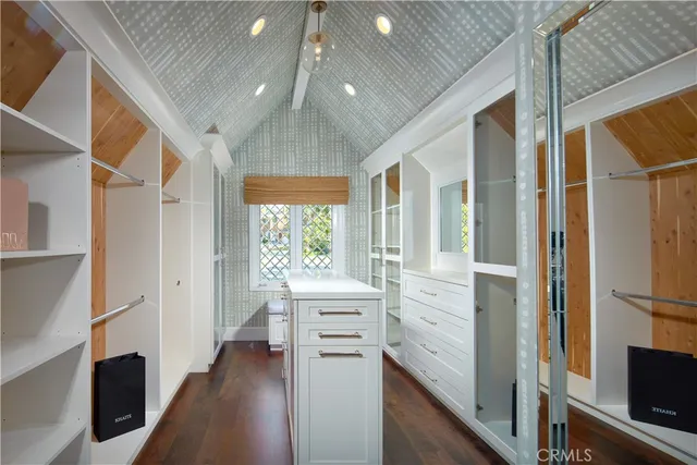 a view of walk in closet with a window
