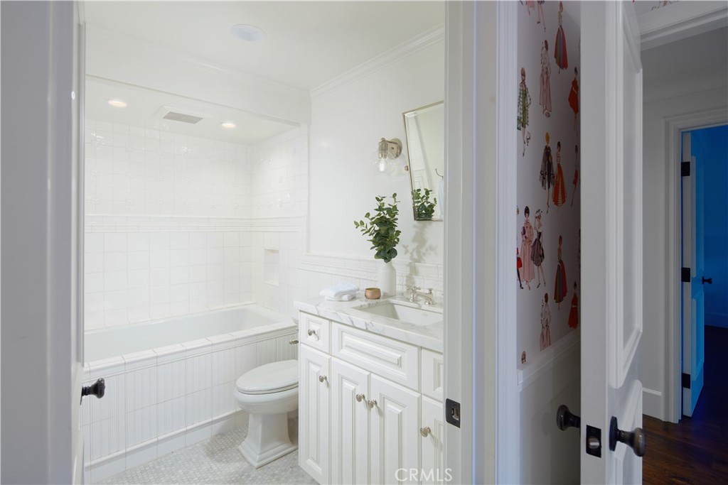 2 Royal St George Road Newport Beach, CA 92660 - Photo 30 of 48 a bathroom with a sink a toilet and shower