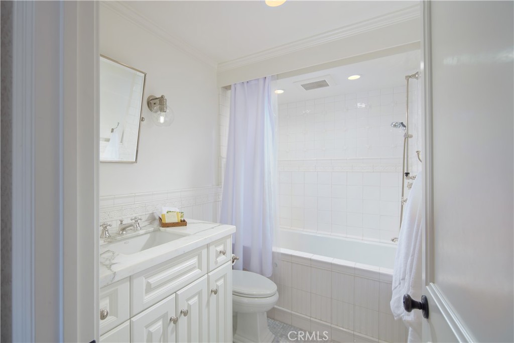 2 Royal St George Road Newport Beach, CA 92660 - Photo 32 of 48 a bathroom with a sink a toilet and shower