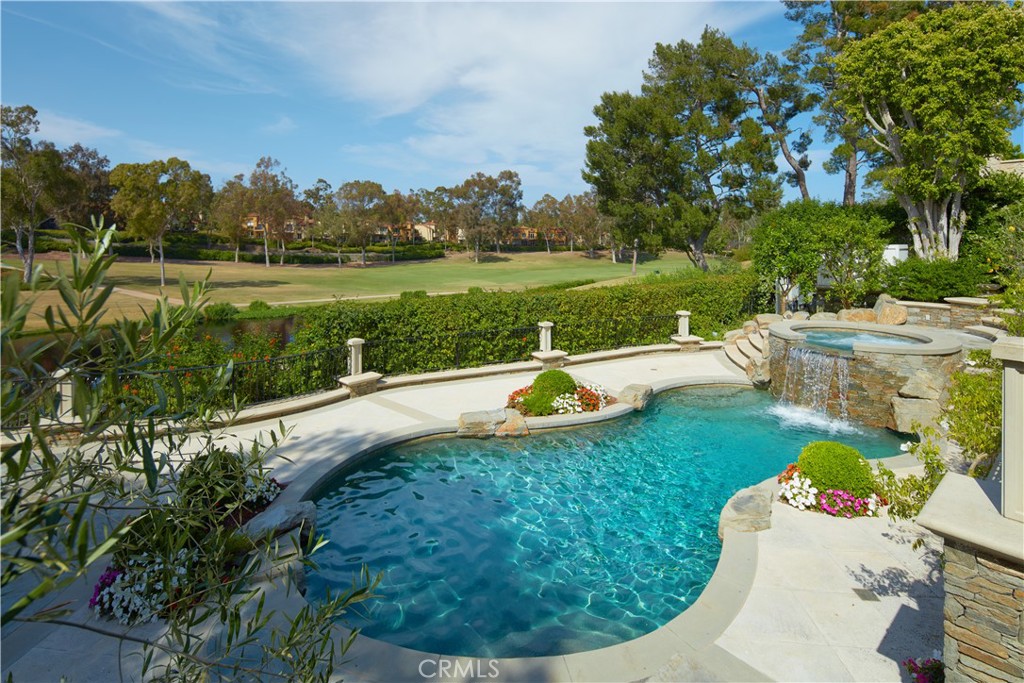 2 Royal St George Road Newport Beach, CA 92660 - Photo 38 of 48 a view of a swimming pool with a yard and a fountain