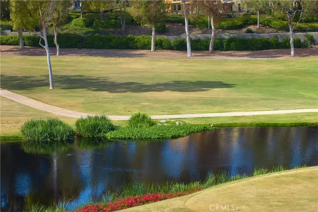 a view of a swimming pool with a lake view