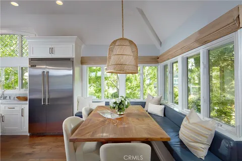a view of a dining room with furniture window and outside view