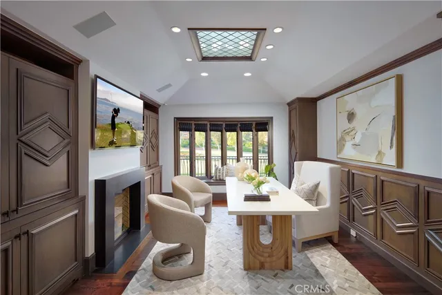 a living room with furniture and a floor to ceiling window