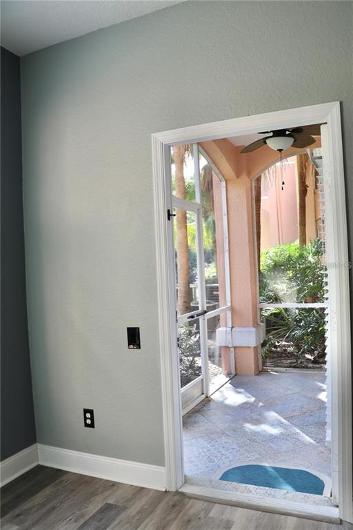 13548 Turtle Marsh Loop, Unit 413 Orlando, FL 32837 - Photo 22 of 27 a view of front door with wooden floor