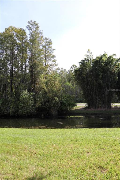 13548 Turtle Marsh Loop, Unit 413 Orlando, FL 32837 - Photo 23 of 27 a view of outdoor space with yard